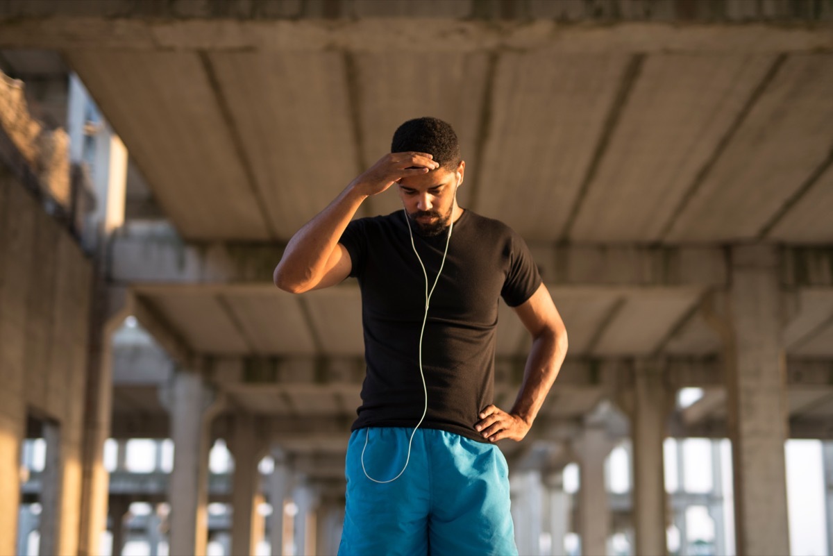 Black man feels dizzy while he is going for a run