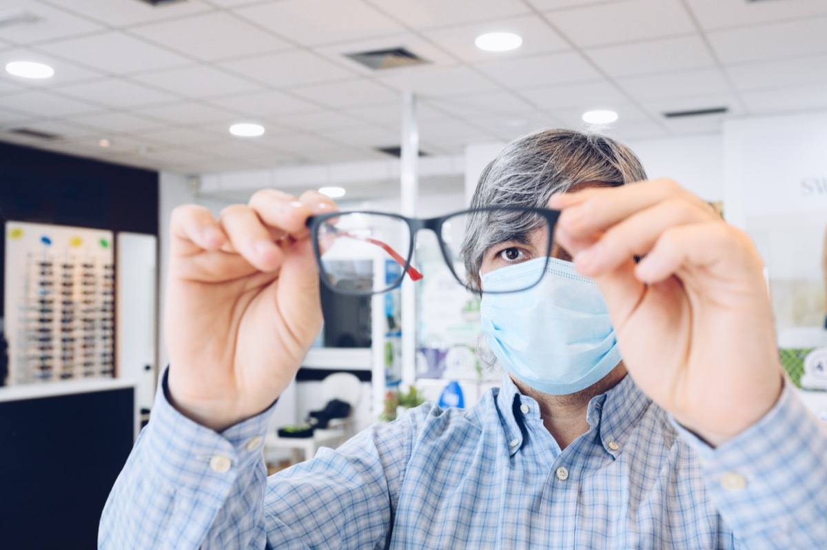 man with mask at opthamologist