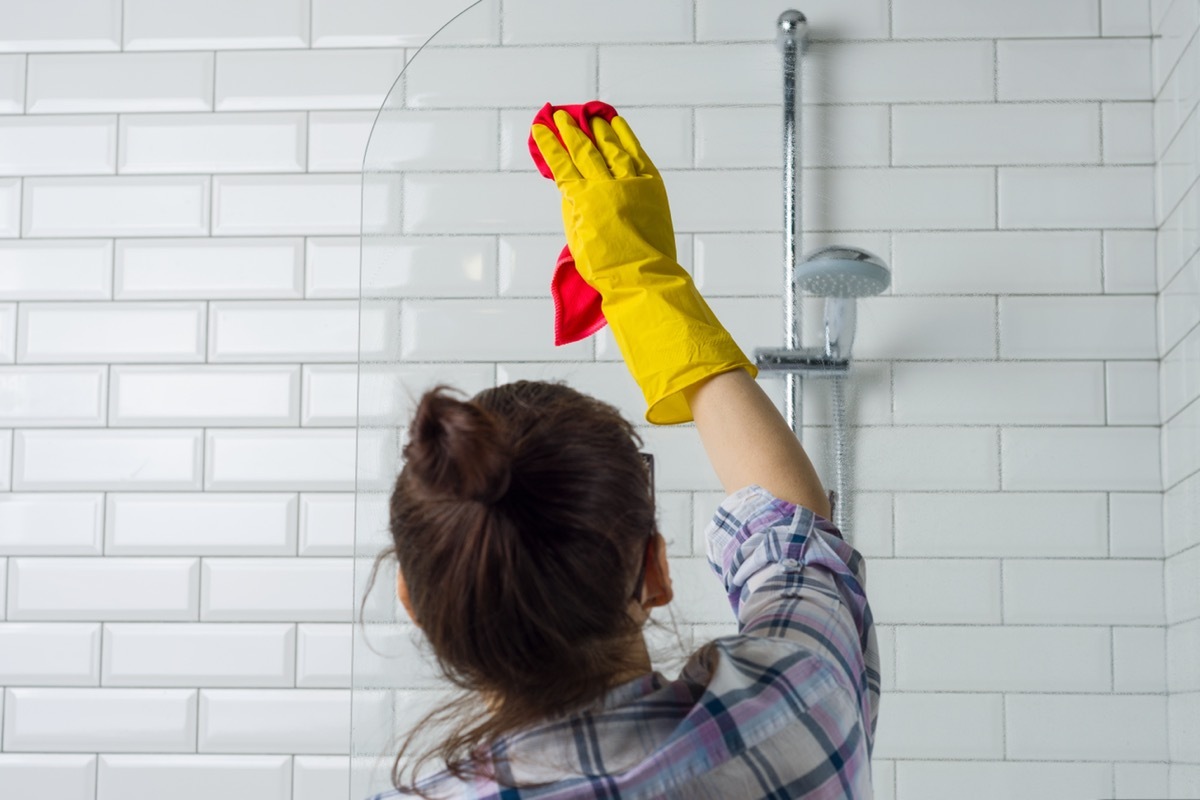  Woman cleaning in the bathroom at home