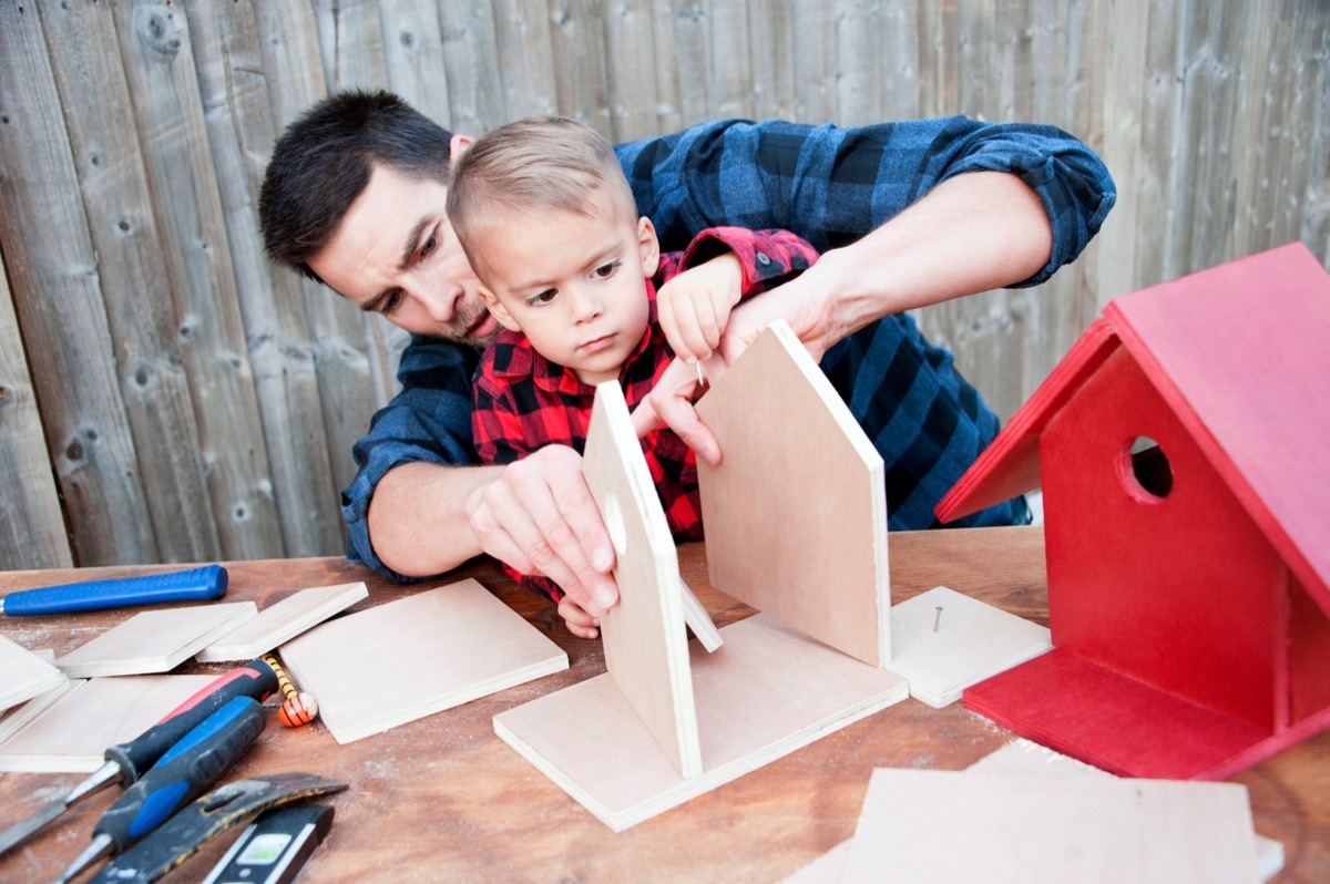 Father and son building together