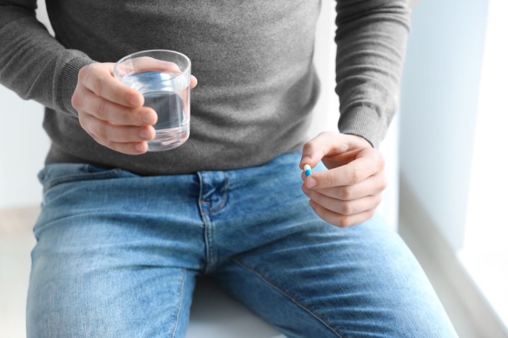 Man Taking Pill Predictions About the Future