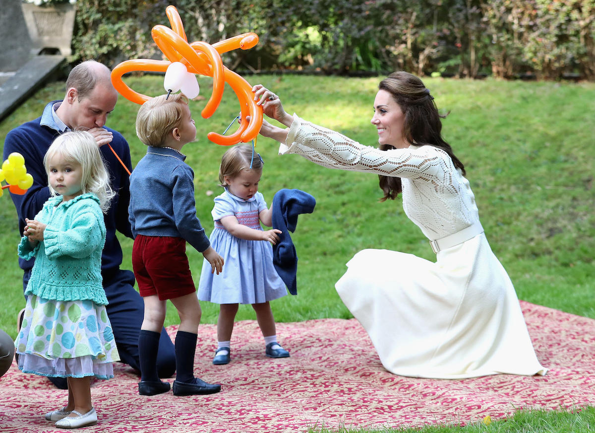 The Duke and Duchess of Cambridge with their children Prince George and Princess Charlotte at a children's party for Military families at Government House in Victoria during the Royal Tour of Canada in 2016