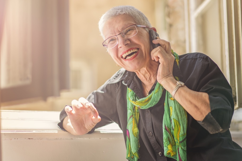 mother receiving phone call lies over 40