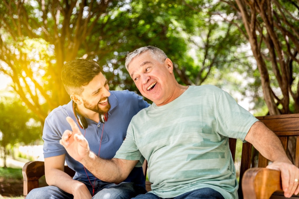 father and son laughing