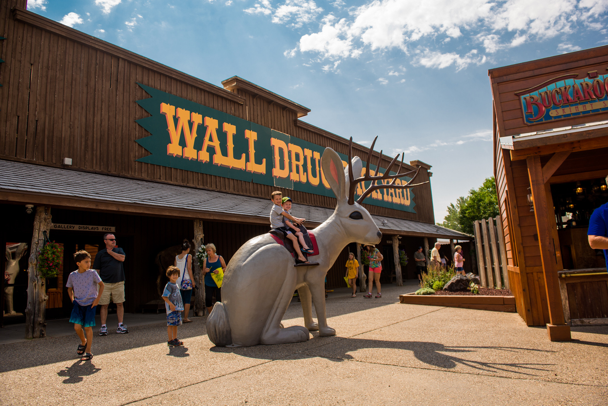 Two boys pose for a photo on the Jackalope at Wall Drug in Wall, South Dakota during the summer of 2017