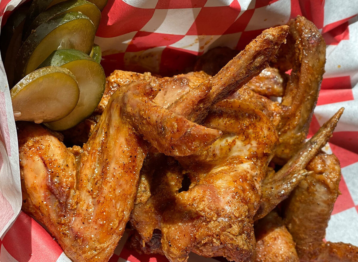 plate of wings with pickles