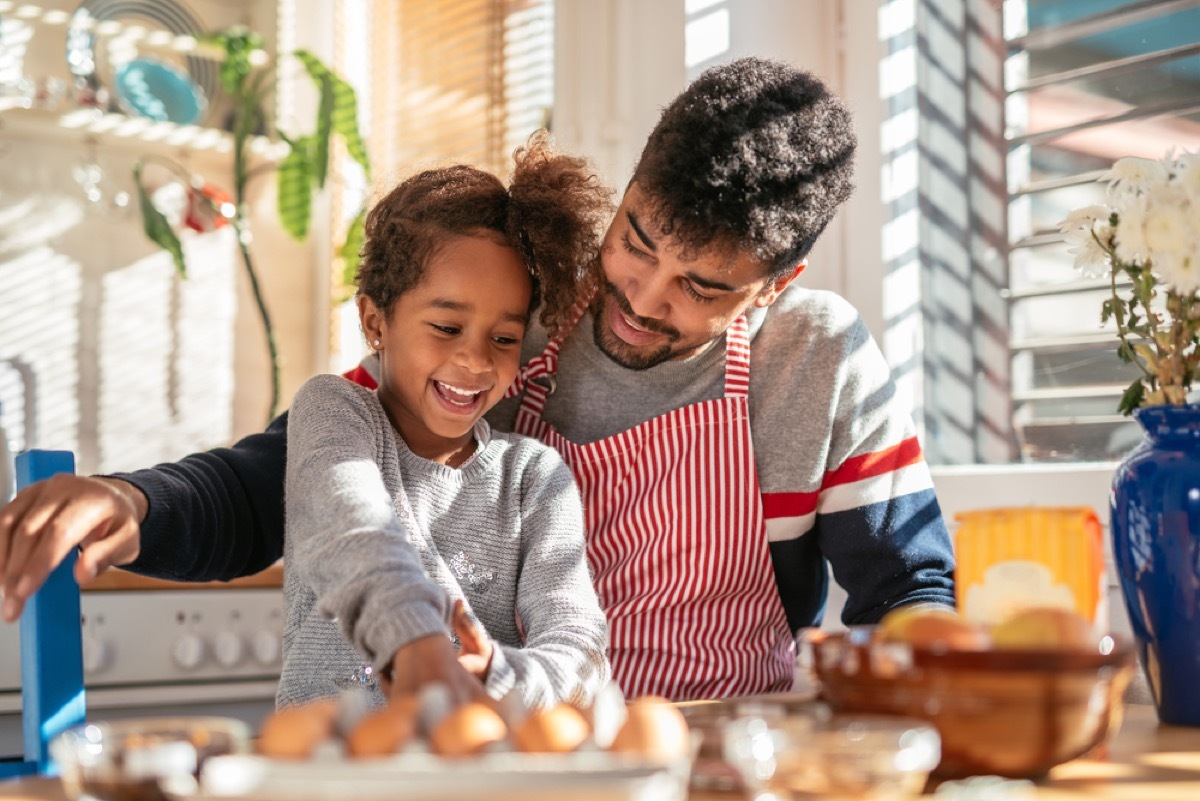 dad cooking with his daughter, skills parents should teach kids