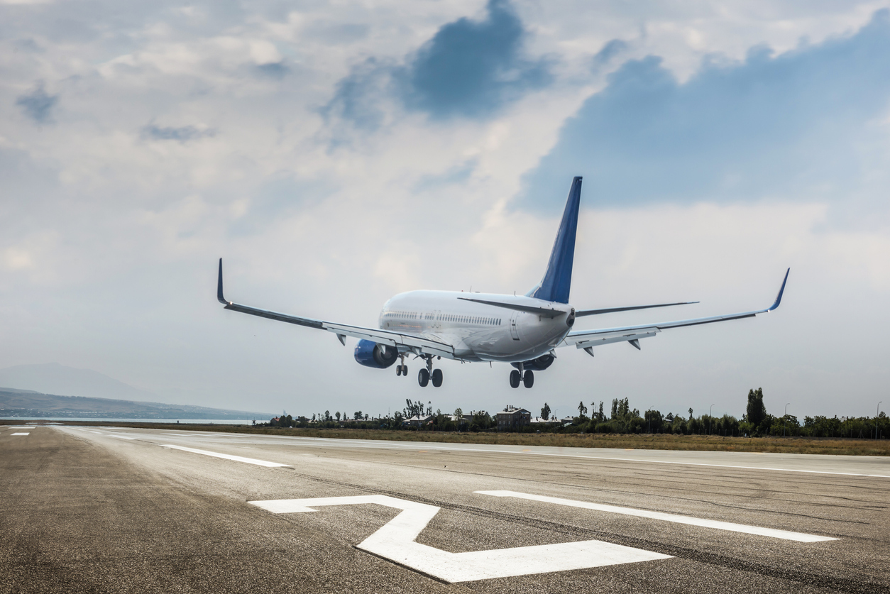 A passenger plane landing at an airport