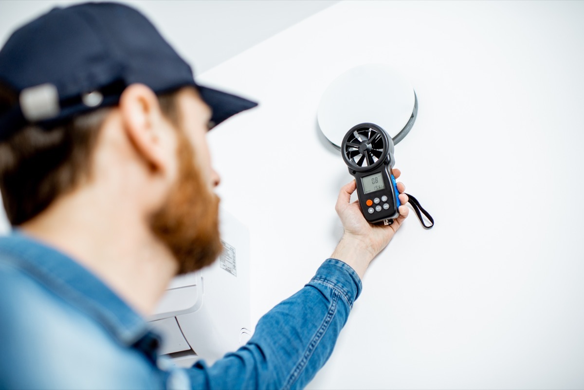 Man checking home for draft