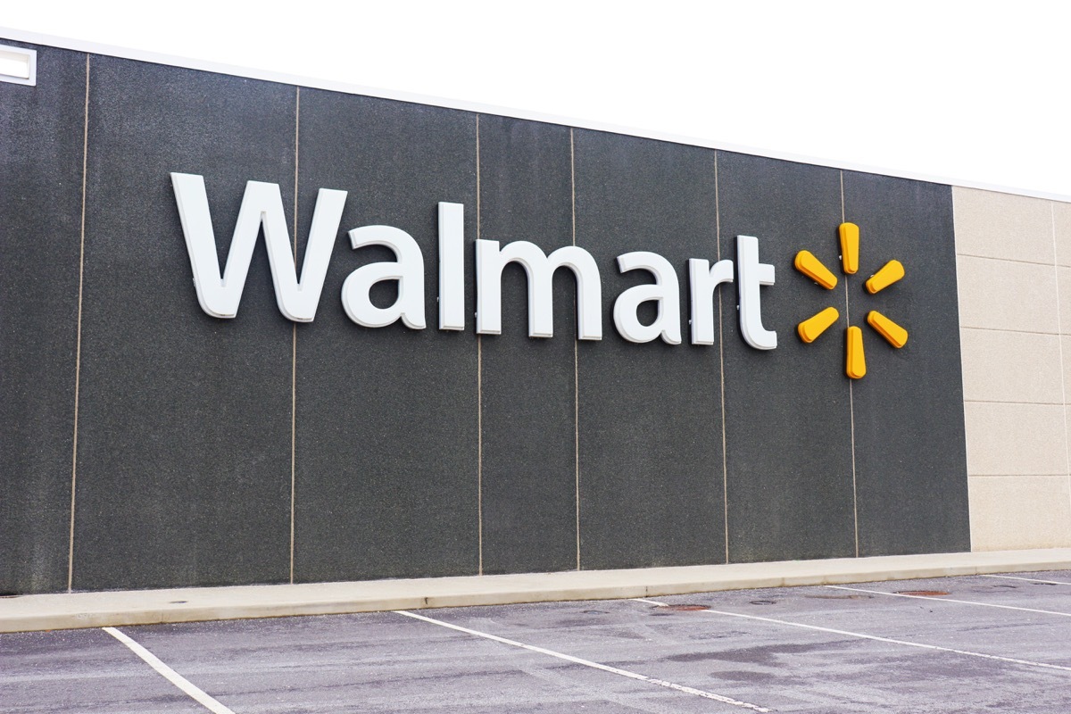 Walmart big sign at supermarket's outside wall.