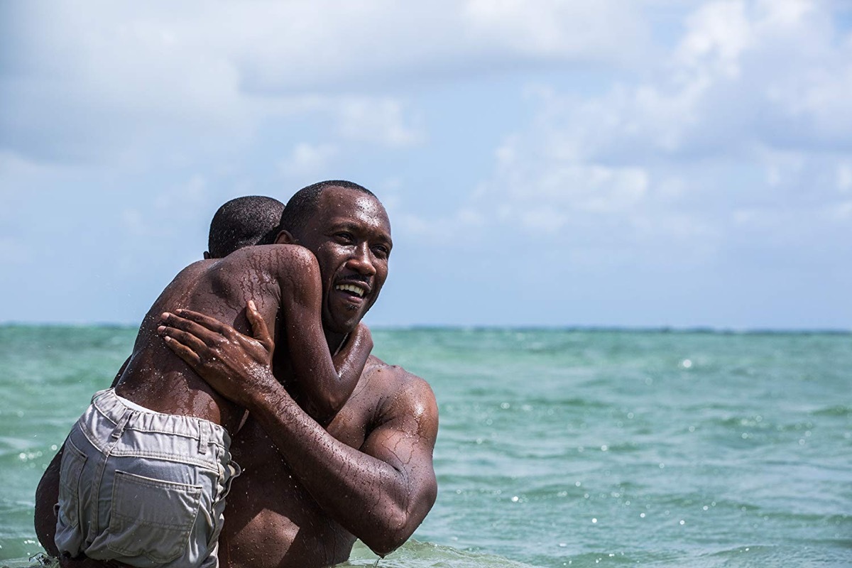 Mahershala Ali and Alex R. Hibbert in Moonlight (2016) movies on rotten tomatoes with the highest ratings