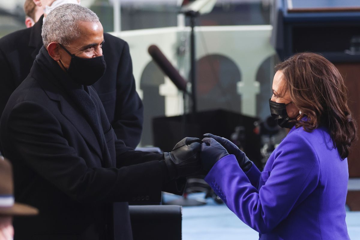 Former US President Barack Obama (L) bumps fists with US Vice President-elect Kamala Harris as they arrive for the inauguration of Joe Biden as the 46th US President, on the West Front of the US Capitol in Washington, DC on January 20, 2021