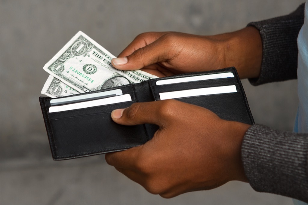 man taking money out of a wallet National Geographic bee questions