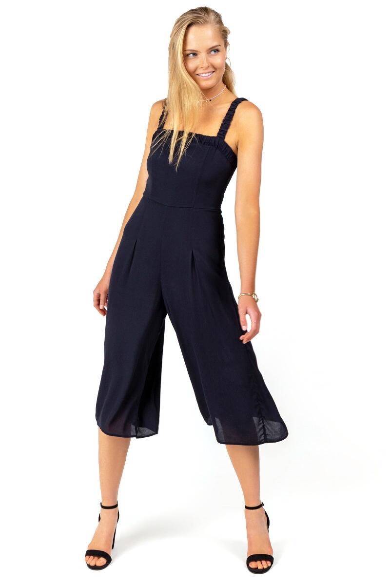 woman wearing black jumpsuit, end of summer sales 2019