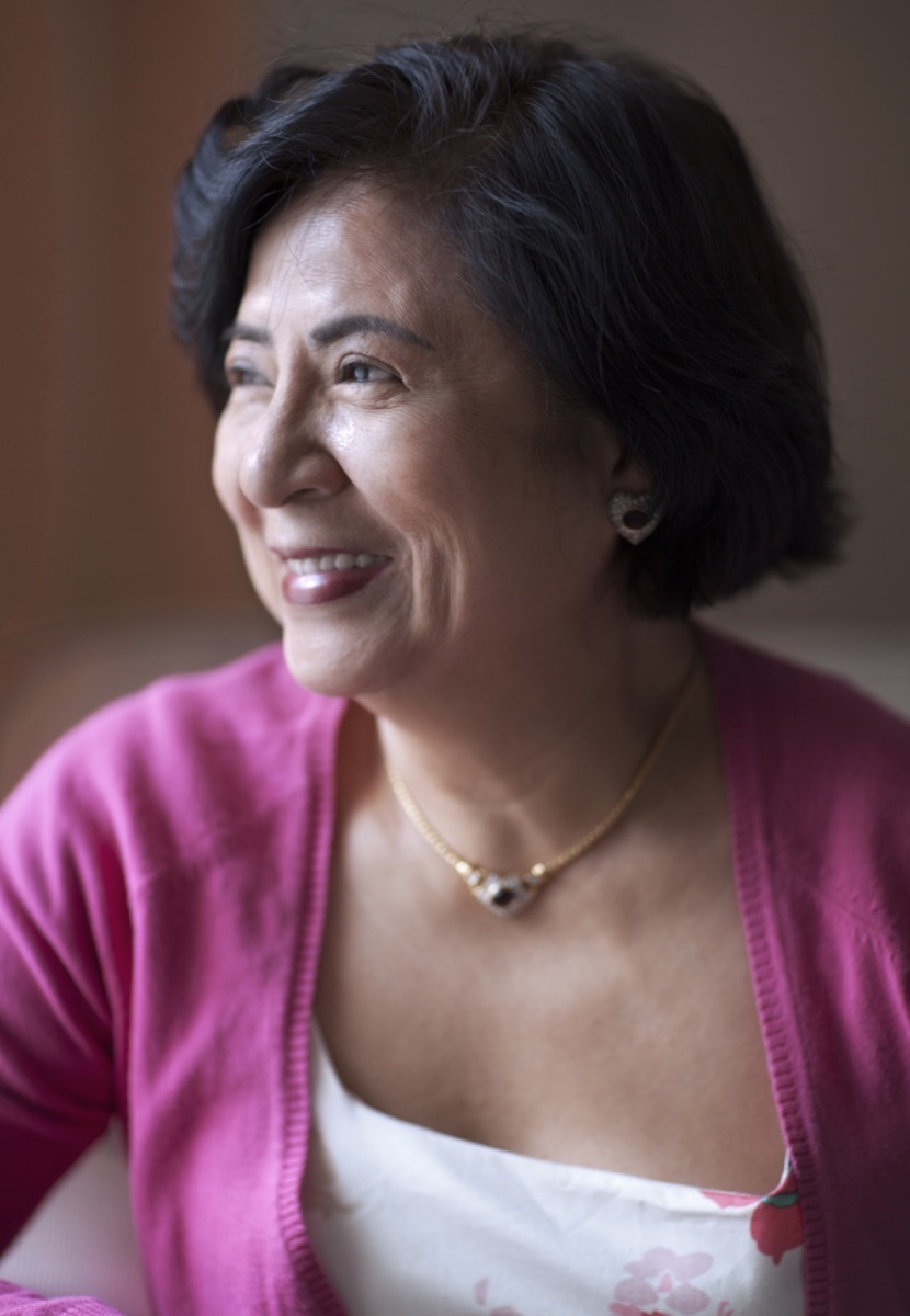 Older Asian woman wearing choker necklace