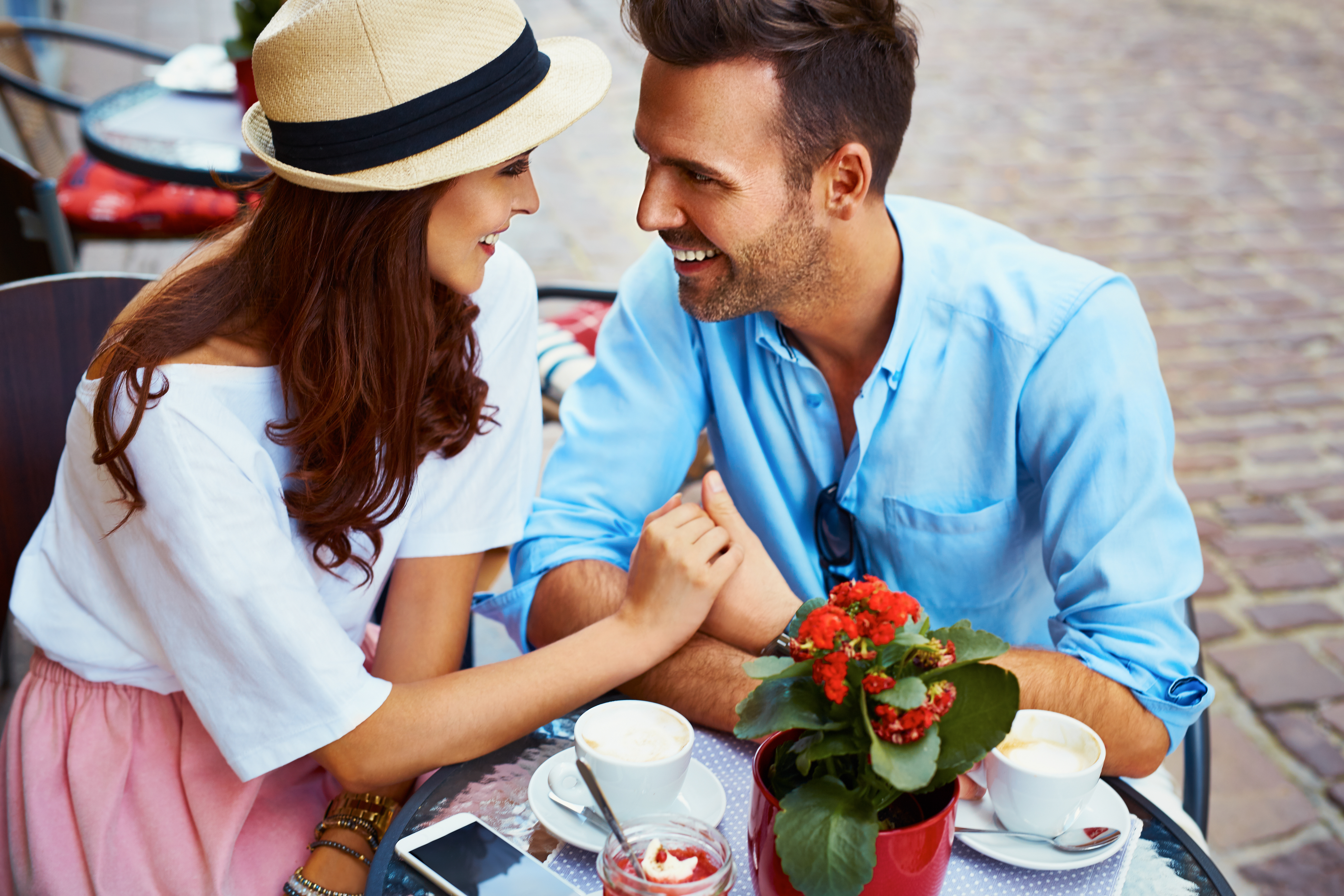 man and woman having a romantic date at sidewalk cafe, what he wants you to say