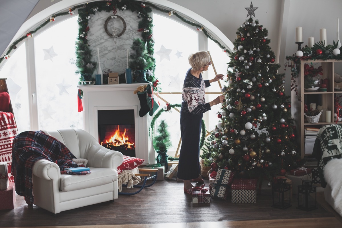 woman decorating her home for christmas