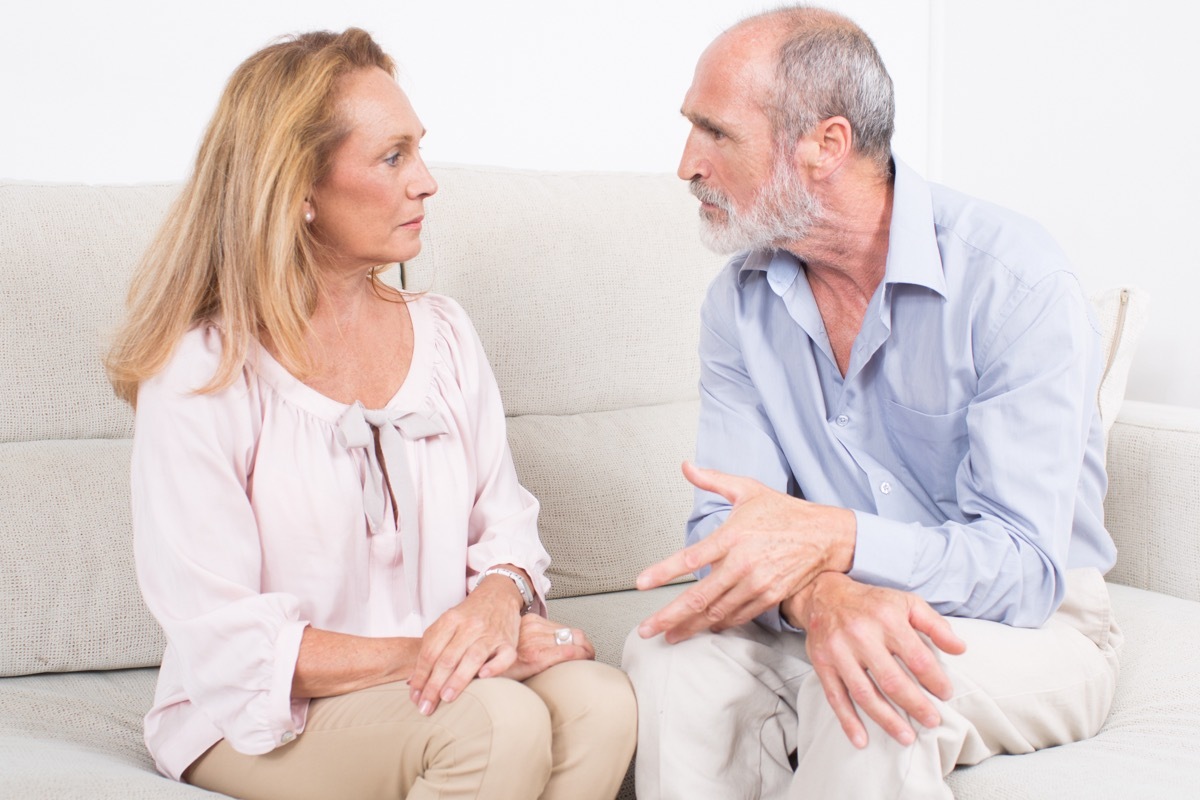 older couple talking on couch