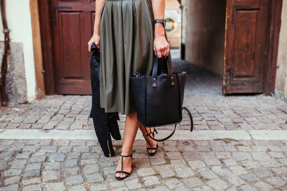 woman in leather midi skirt