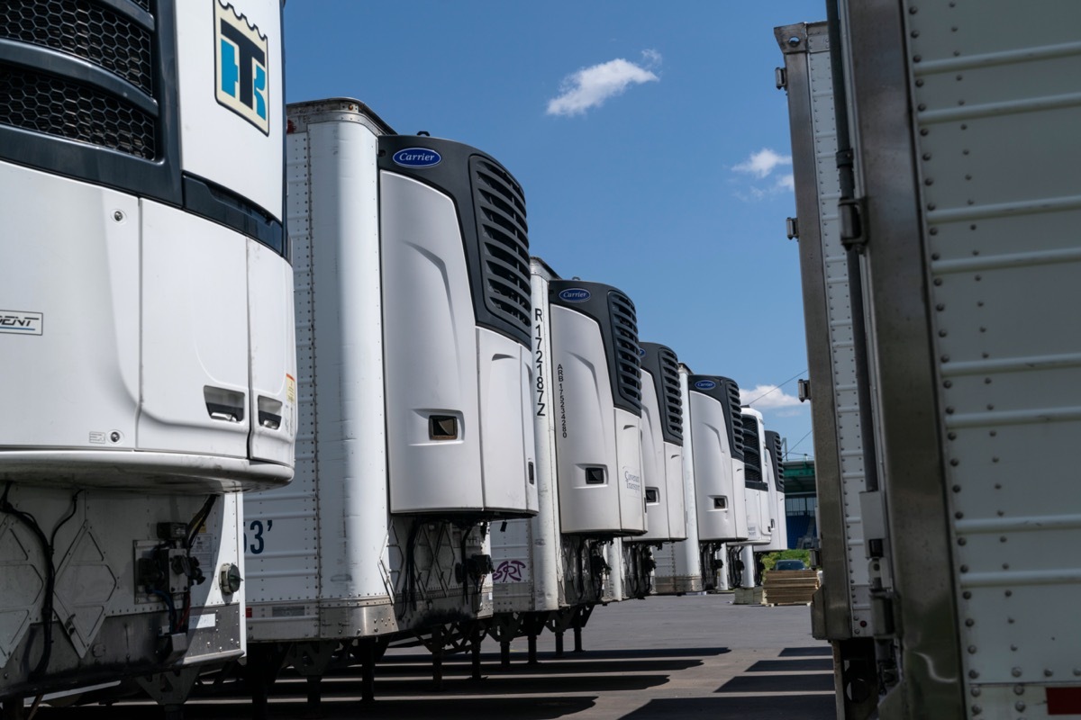 Dozens of refrigerated trucks and containers seen on Randall's Island prepared for influx of dead bodies as morgue amid COVID-19 pandemic