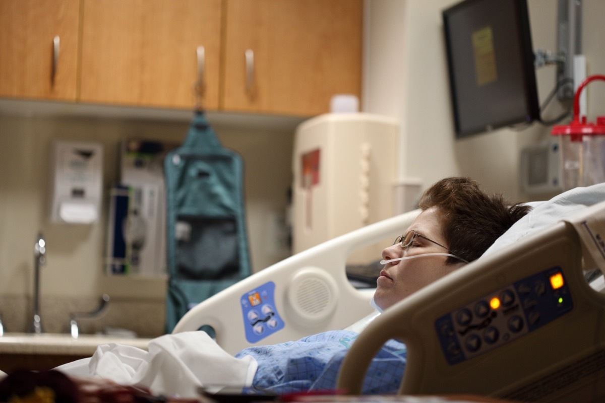 woman trying to sleep in hospital