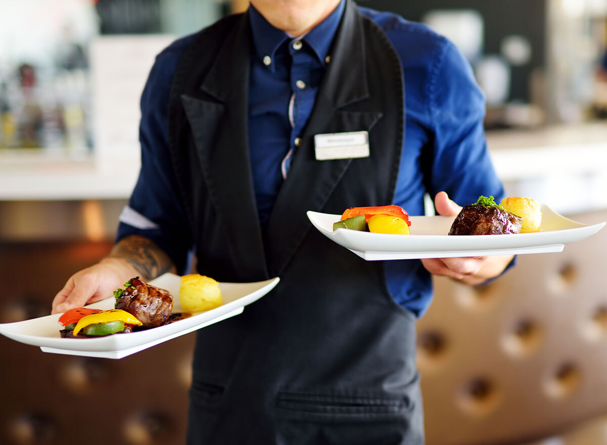 waiter carrying plates