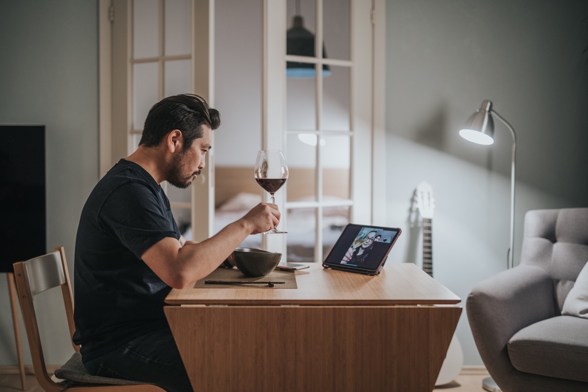 Photo series of a virtual dinner date with video call during lockdown.