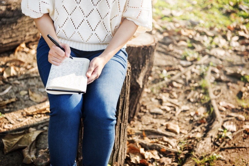 woman writing in journal {Conquer Negative Thinking}