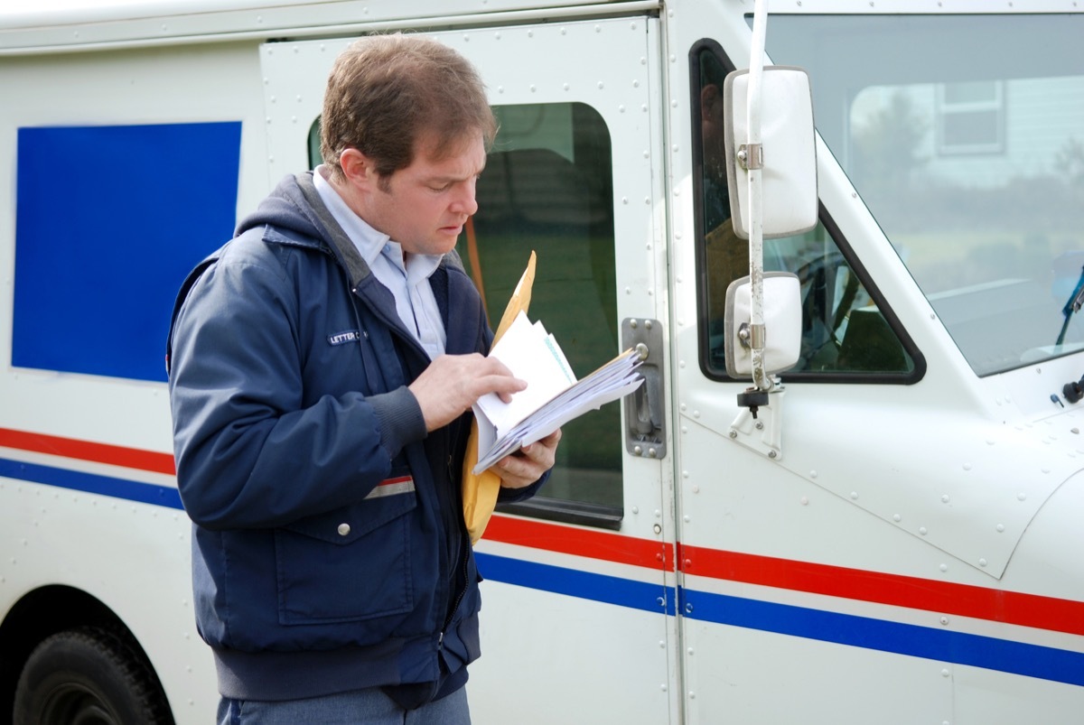 Mail Carrier Sorting the mail