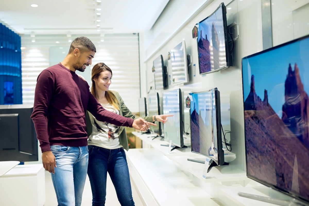 interracial couple buying TV