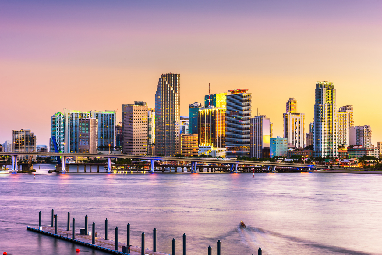 The skyline of Miami, Florida from the water at sunset