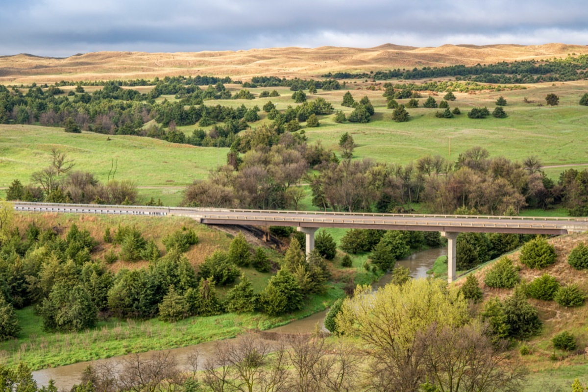 trees, sand hills and a bridge overcasting Dismal River in Nebraska Sandhills, Nebraska