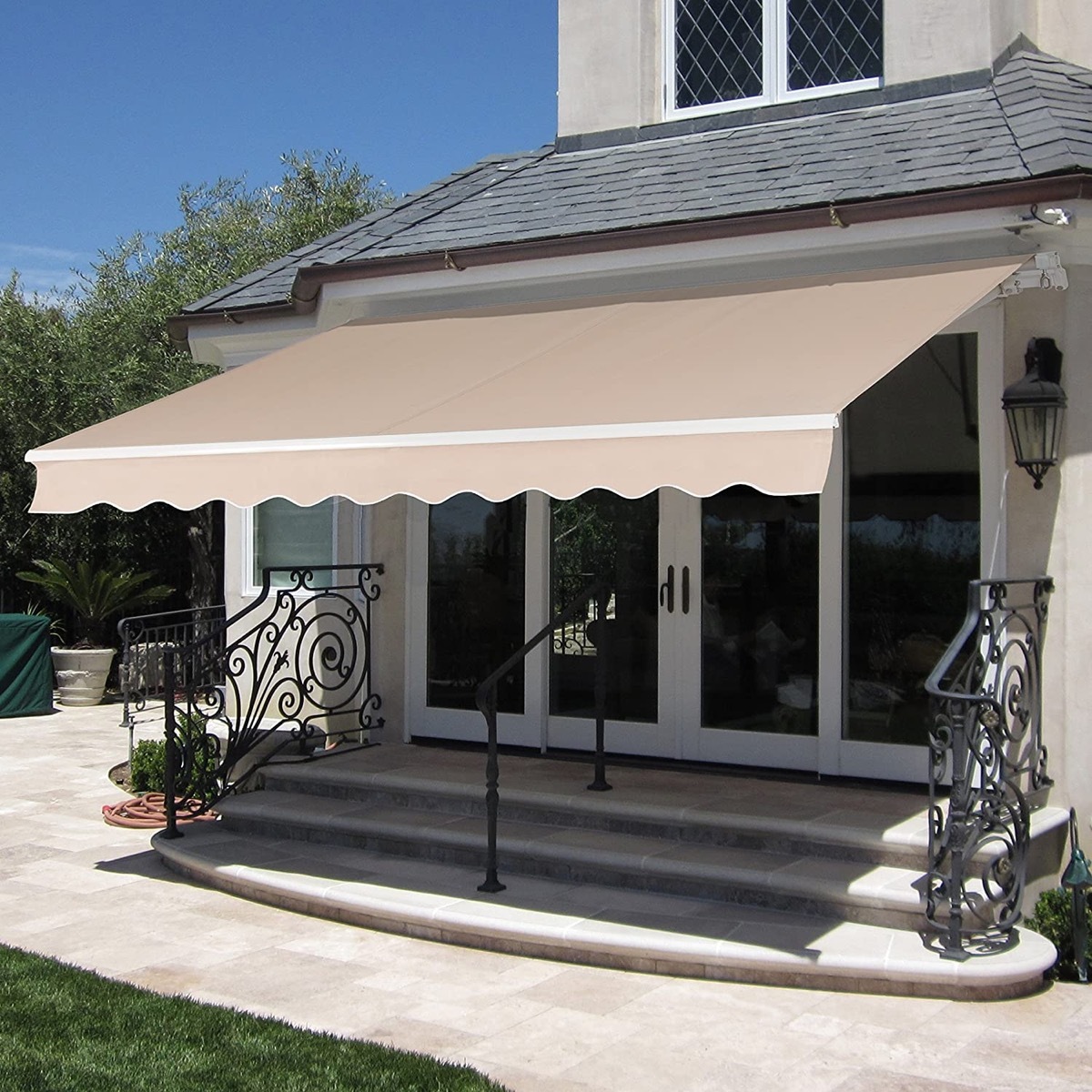 tan patio awning over steps leading up to house