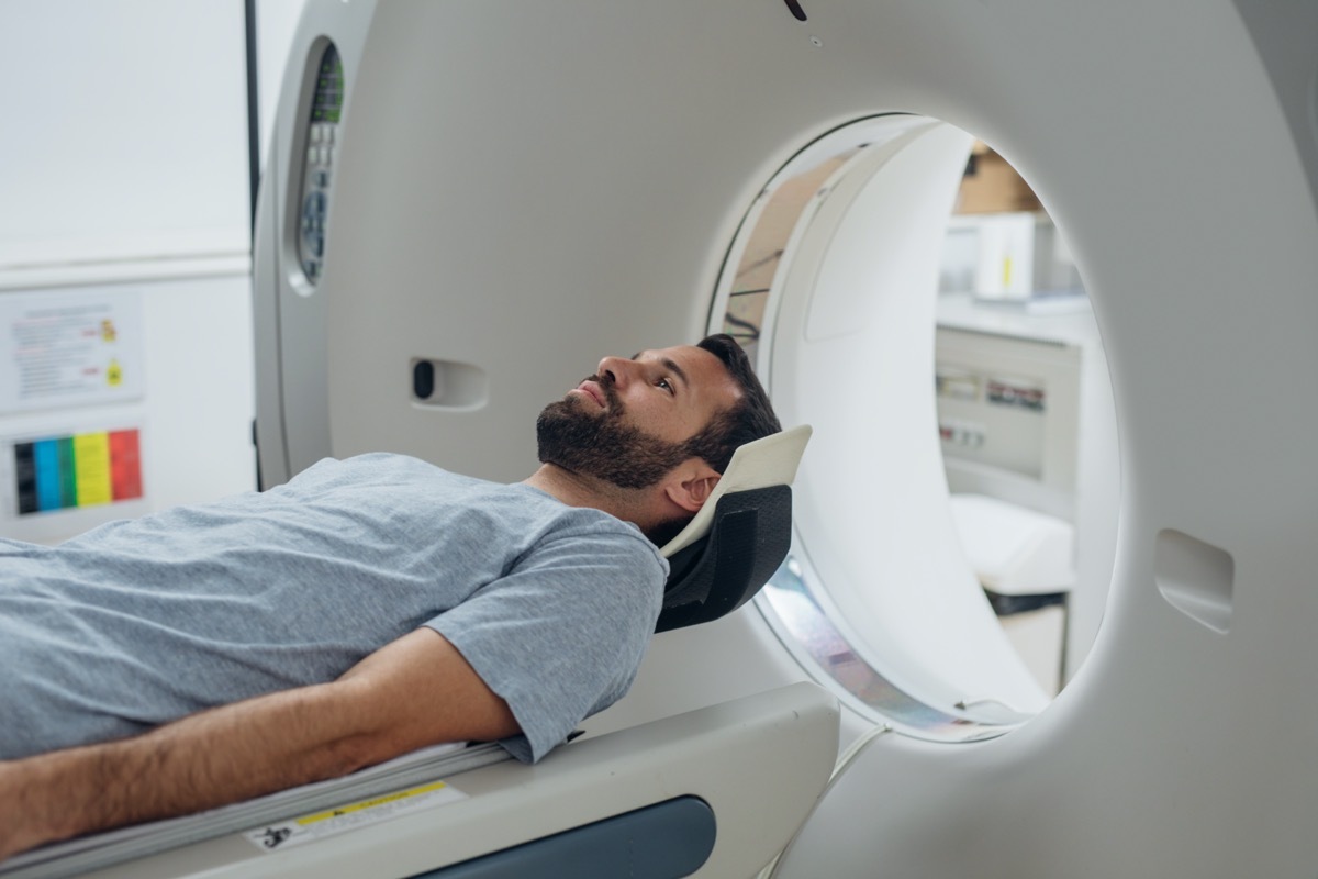 Patient lying on the TC scanner bed waiting to be scanned