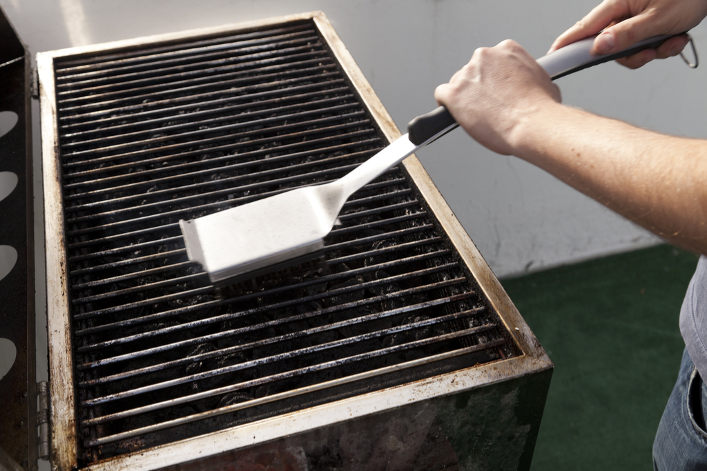 Man Cleaning Grill Summer