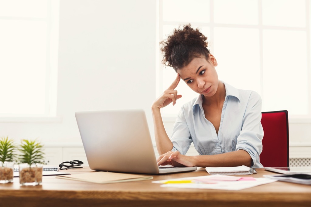 woman looking at computer, things you should never say to a teacher