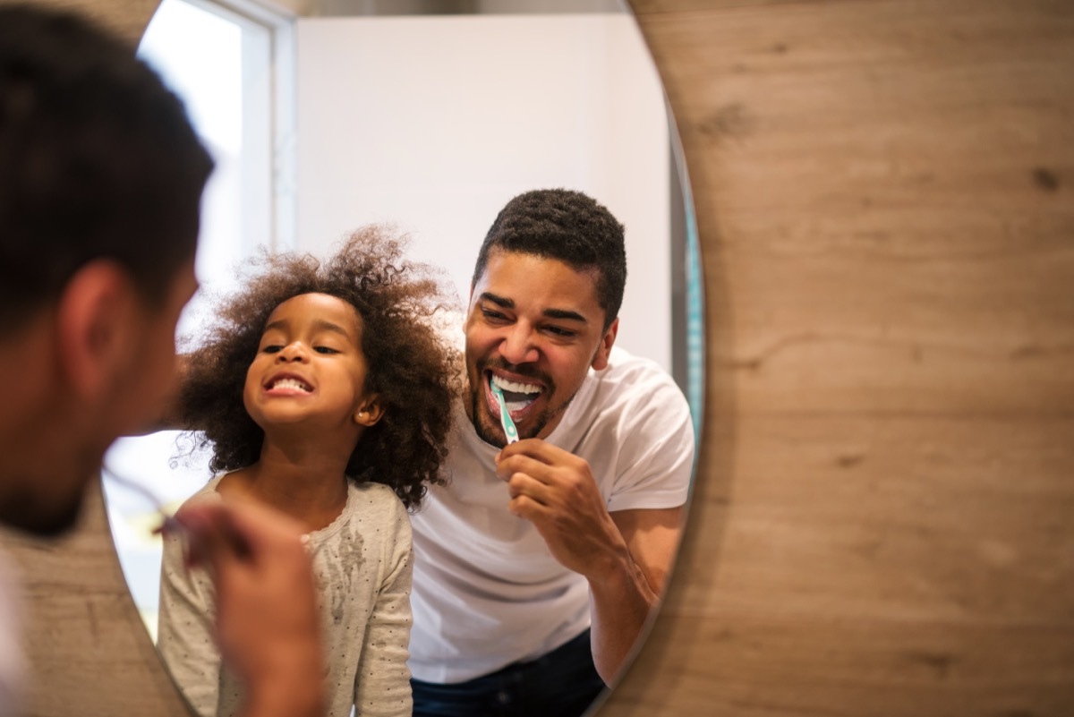 family brushing their teeth