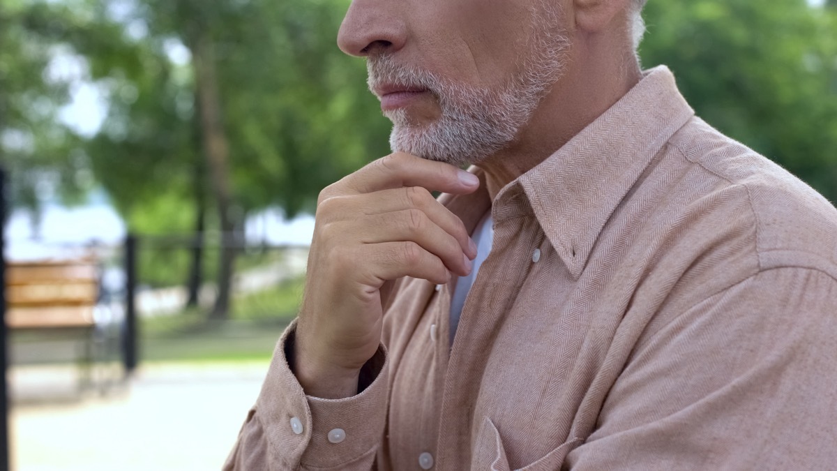 bearded man thinking of decision