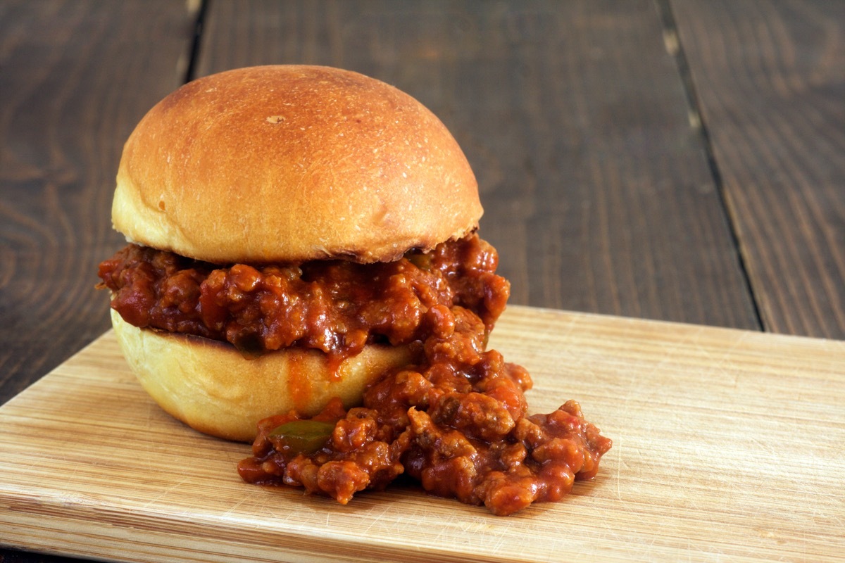 sloppy joe sandwich on wooden board