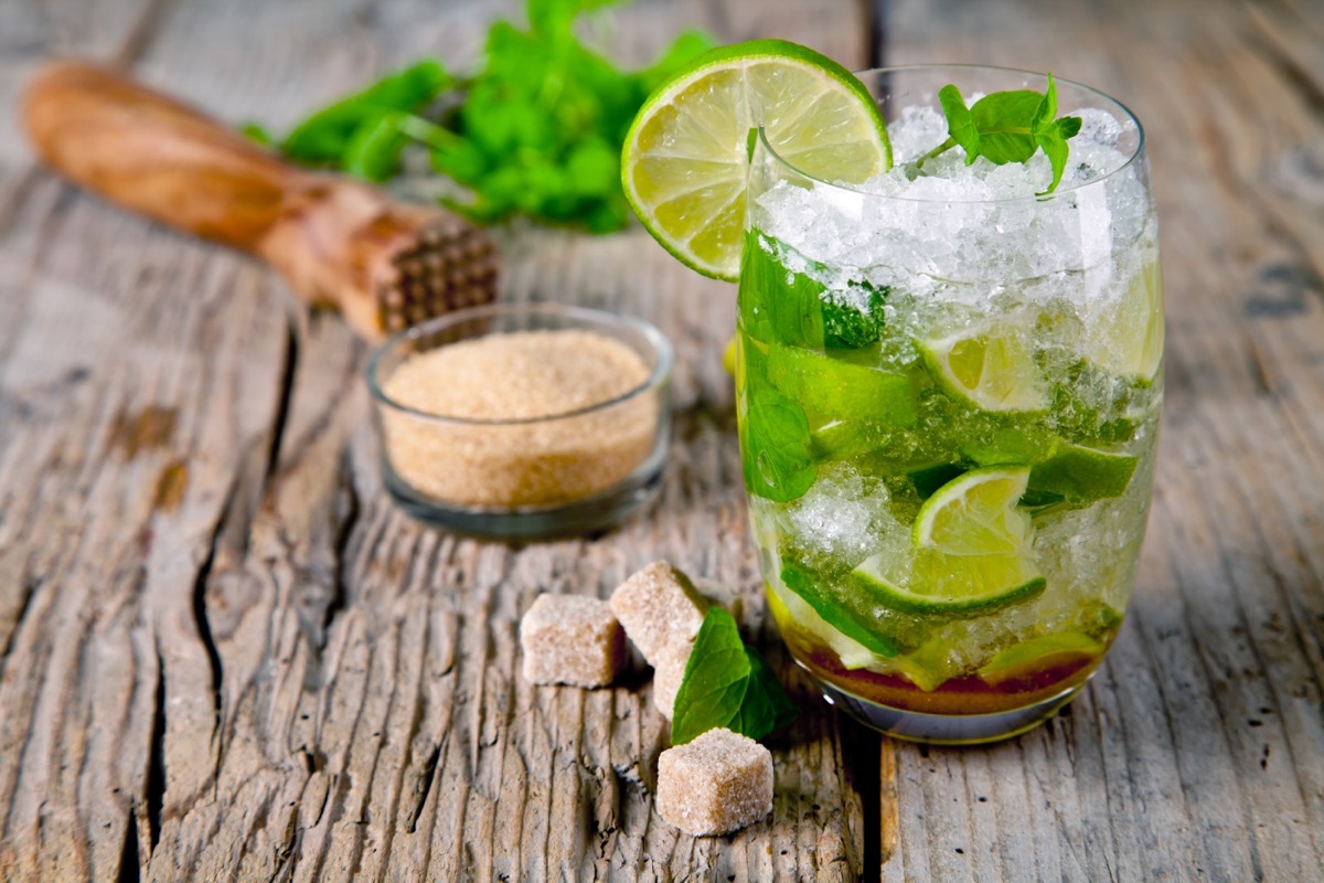 mojito in glass, with ice, sugar and lime