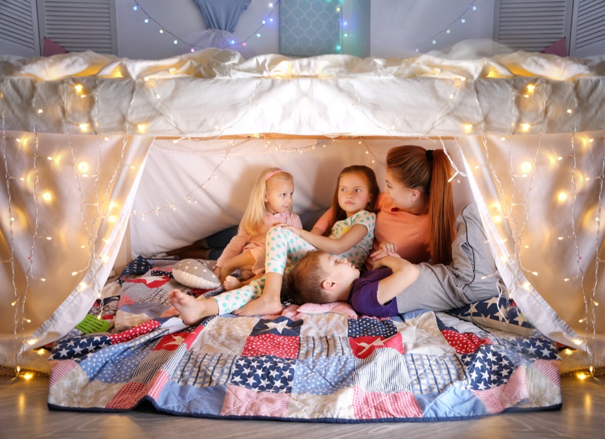 Kids in a fort with their mother