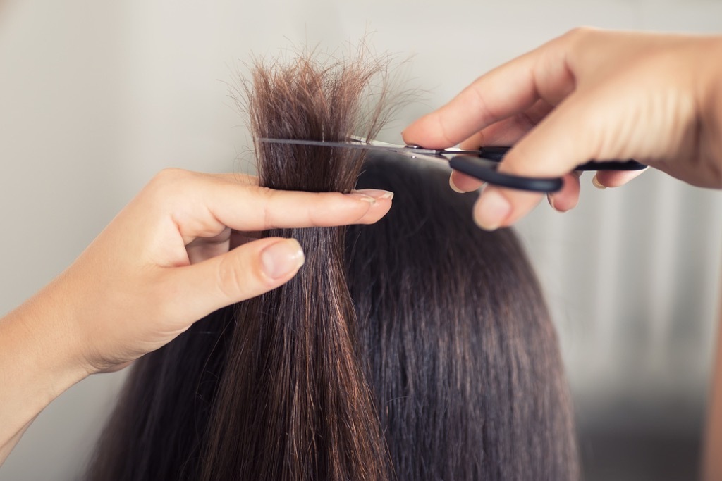 woman getting hair trim, relationship white lies