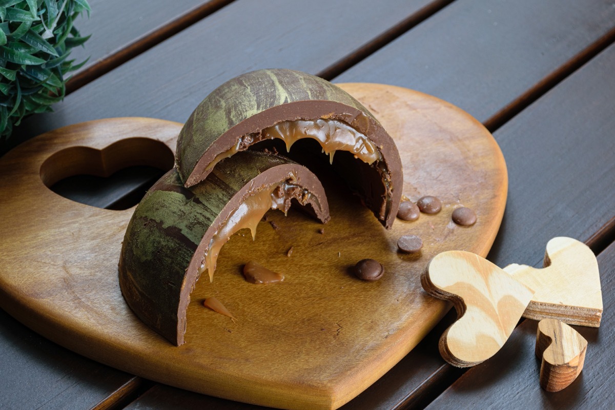 caramel chocolate easter eggs on wooden board