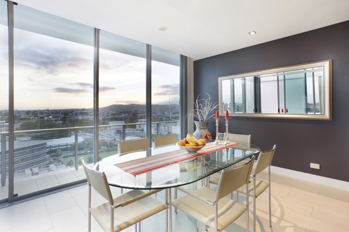 Glass kitchen table with full length window view