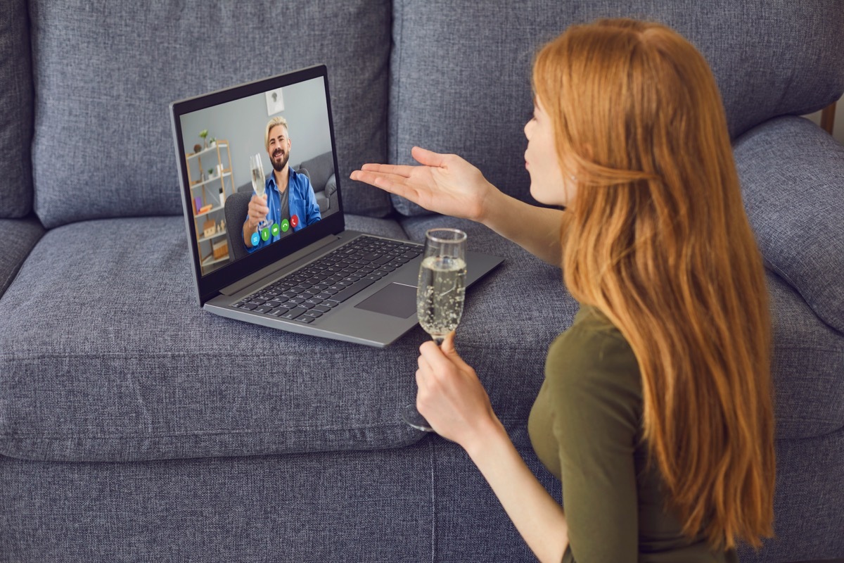 Couple drinking champagne during a video date