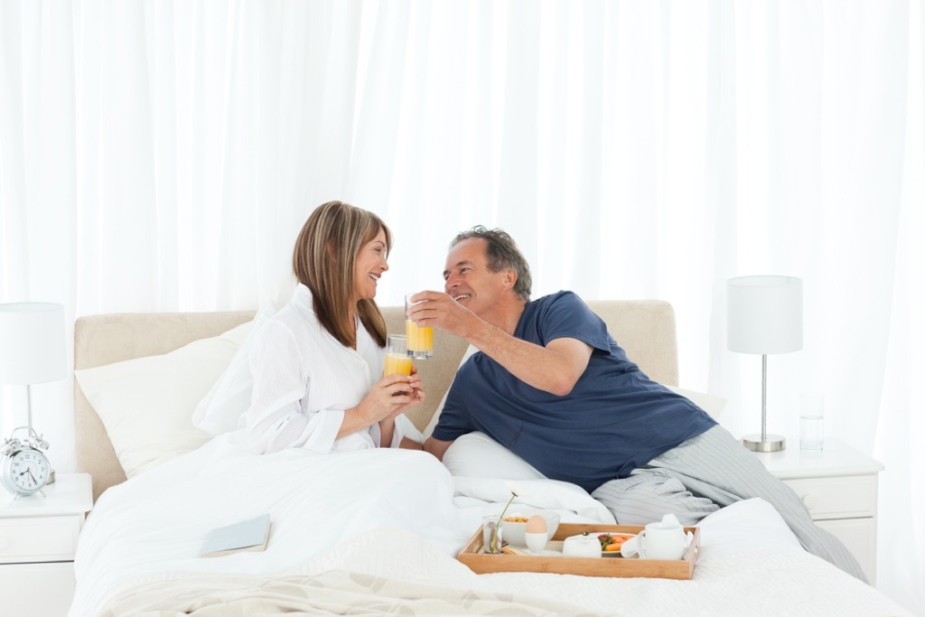 older couple in bed together, better wife after 40