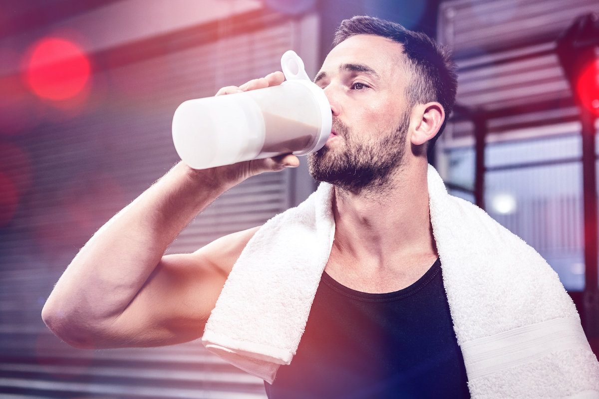 Man drinking protein shake after workout