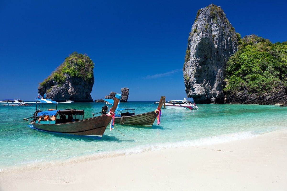 wooden boats on ko phi phi beach