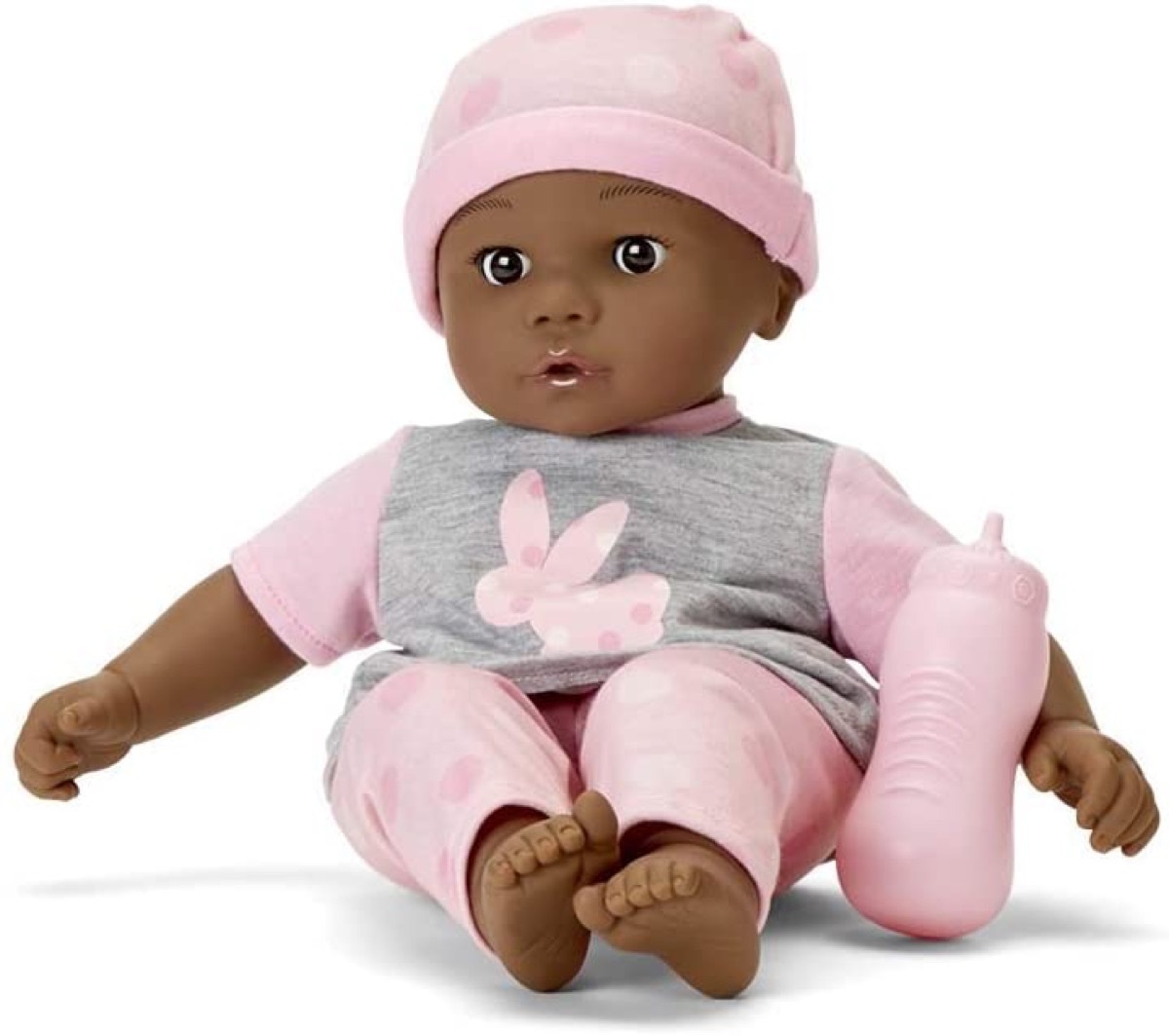 baby doll in pink and gray outfit with pink baby bottle