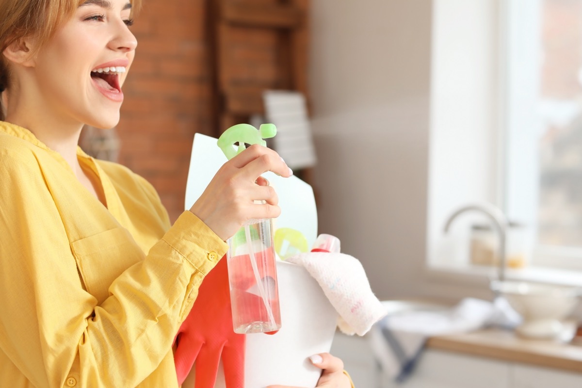 Woman Spraying Air Freshener